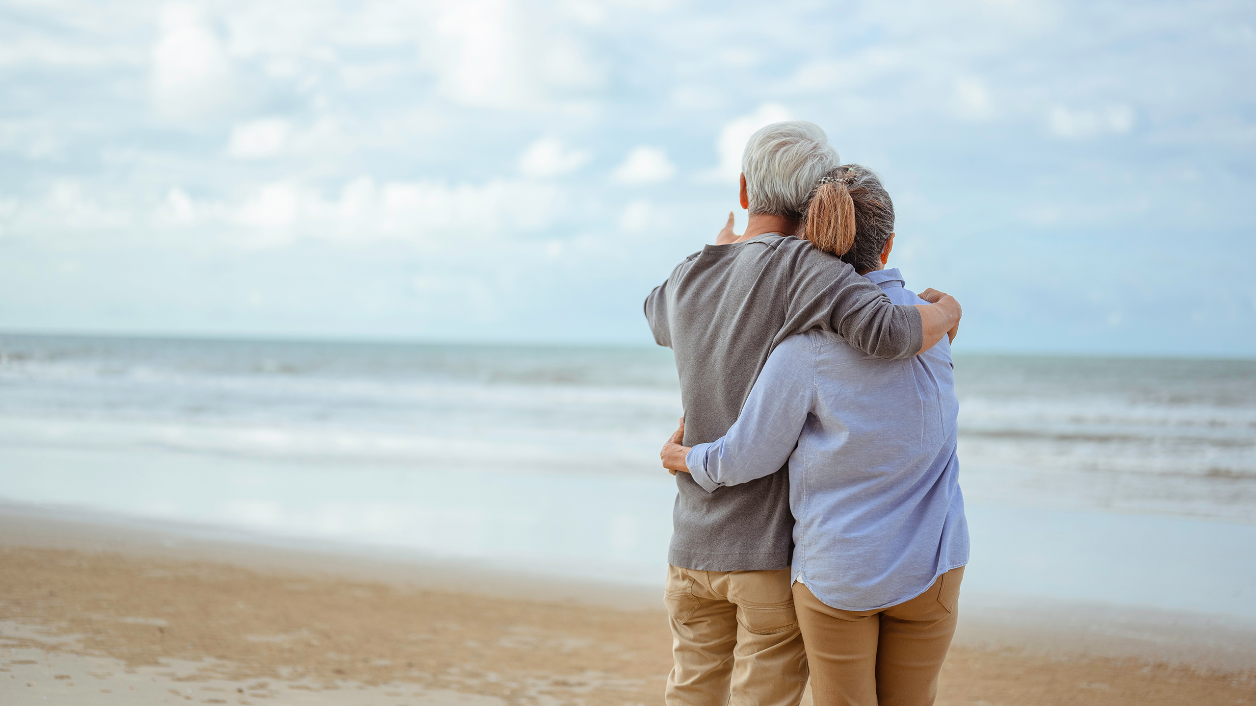 elderly couple on beach